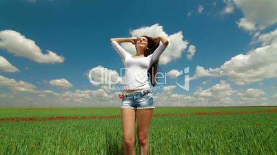 Young Woman In A Green Wheat Field