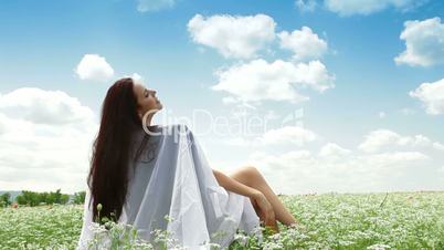 Young Woman Enjoying Summer Day In The Field