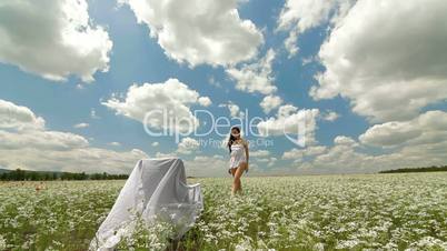 DOLLY: Young Woman In White Blossoming Meadow