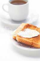 tea and toast with butter isolated on white