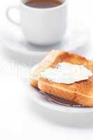 tea and toast with butter isolated on white