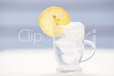 water with lemon and lime in a glass with ice