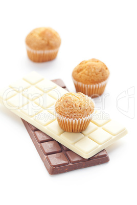 bar of chocolate and muffin isolated on white