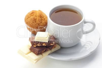 bar of chocolate,tea and muffin isolated on white