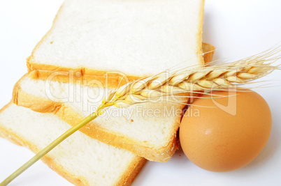 Bread, wheat ear and egg