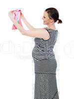 Pregnant woman looking at baby cloth, rejoicing