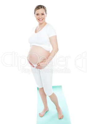 Pregnant woman touching her belly