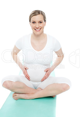 Studio portrait of pregnant woman