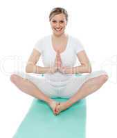 Pretty woman in yoga gesture