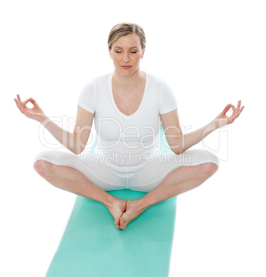 Young woman meditating in lotus pose