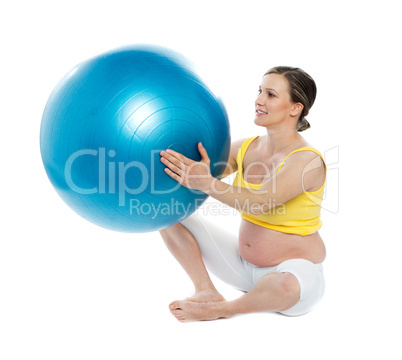 Pregnant woman excercises with a gymnastic ball