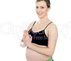 Gorgeous pregnant woman doing yoga