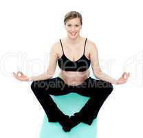 Beautiful pregnant woman in lotus pose