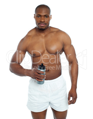 Athlete posing with health drink bottle