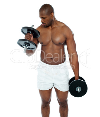 Young african man doing biceps exercise