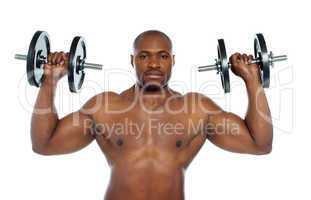 Shirtless african male holding dumbbells
