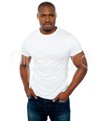 Trendy muscular guy posing in style