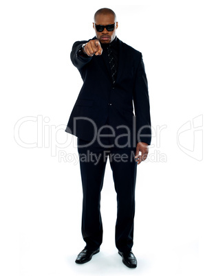 Businessman pointing at you. Full-length portrait