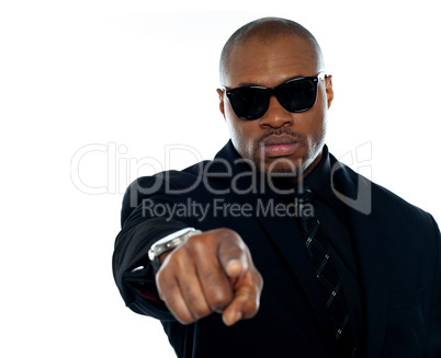 Corporate businessperson pointing at you