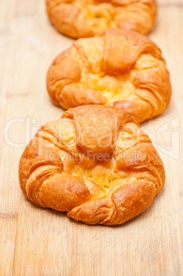 fresh baked french croissant brioche on wood board