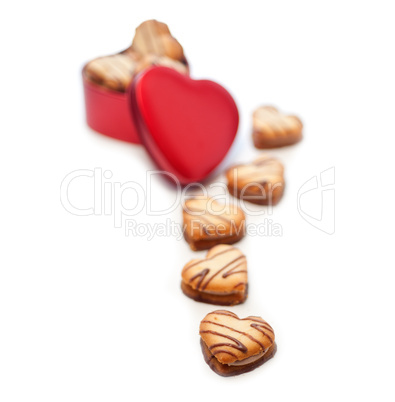 heart shaped cream cookies on red heart metal box