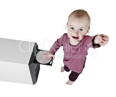 young child playing with CD