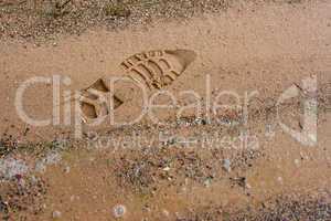 Boot imprint on the beach sand