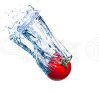Red Tomato Falls under Water with a Splash