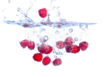 Red Raspberries Falls under Water with a Splash