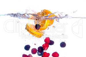 Fresh Fruit Falls under Water with a Splash