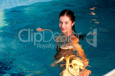 Attractive girl in swimming pool