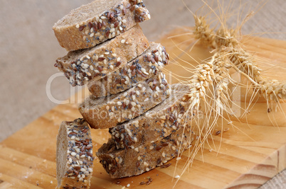 A stack of slices of bread with grains