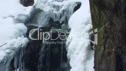 Winter waterfall. Shot with slider. Slow-motion.