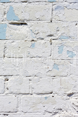 white textured brick wall painted