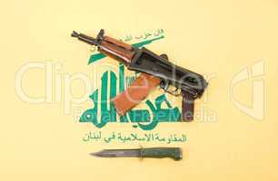 Automatic rifle and flag of Hezbollah
