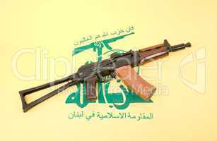 Automatic rifle and flag of Hezbollah