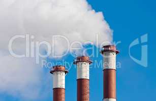 Lots of smoking chimneys other blue sky
