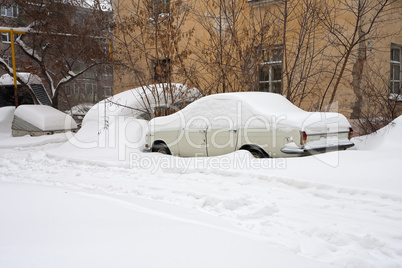 Winter. Car under the snow