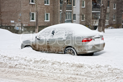 Winter. Car under the snow