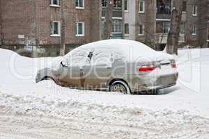 Winter. Car under the snow