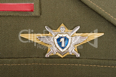 Russian military badge on the green uniform