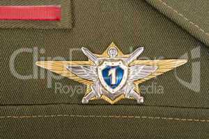 Russian military badge on the green uniform
