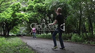 Boy and girl playing in badminton