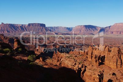 Red rock formations and green valley near Moab, Utah