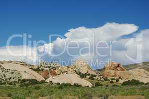 Coloured rocks under blue sky and big clouds in Dinosaur National Monument near Vernal, Utah