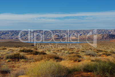 Desert, blue Lake Powell and rugged mountains, Utah