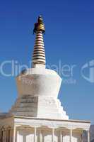 White stupa in a Tibetan lamasery