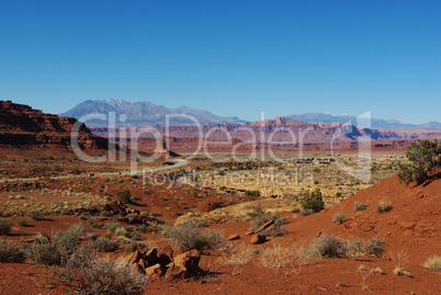 Lonely highway through red rock desert, Utah