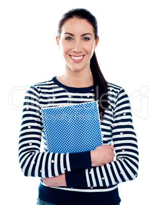 Attractive girl holding blue spiral notepad
