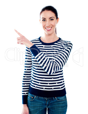 Woman pointing index finger at something
